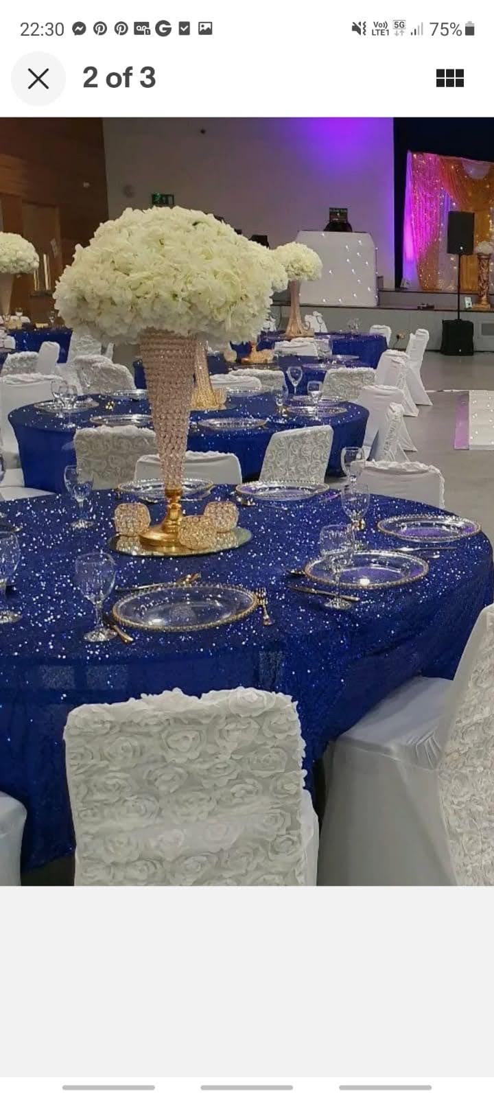 Wedding table with table accessories and a white floral centerpiece