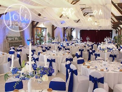 White ceiling draping at a blue and white wedding reception